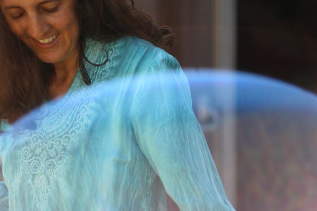 woman-brown-long-hair-ad-blue-blowse-looks-down
