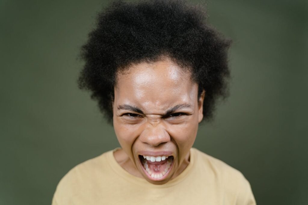 Woman-with-black-curly-hair-screams-at-the-top-of-her-lungs