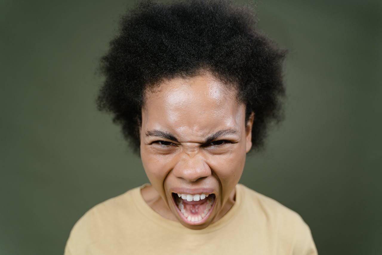 Woman-with-black-curly-hair-screams-at-the-top-of-her-lungs